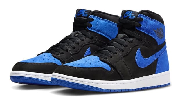 Side view of black and blue Air Jordan sneakers.